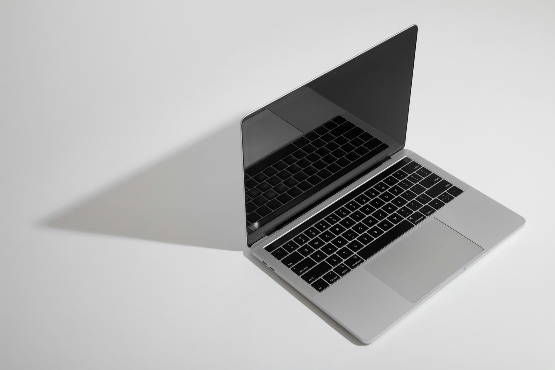 A refurbished business laptop on a plain background
