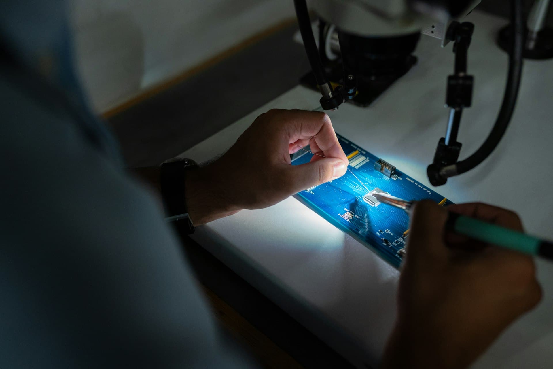 A Noorcom technician working at the repair bench